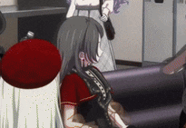 a girl with long hair is sitting on a couch