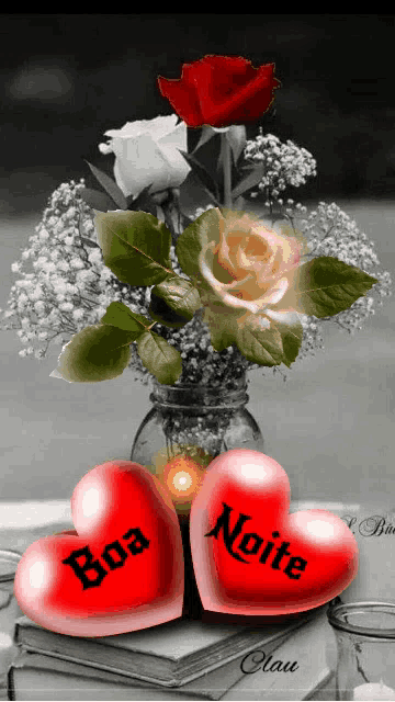 a black and white photo of a vase of flowers and two hearts that say boa noite