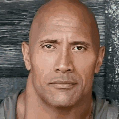 a close up of a man 's face with a large neck and a bald head .