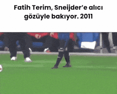 a soccer player kicks a ball on a field with a caption that says fatih terim