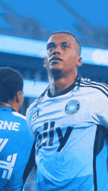 a soccer player wearing a jersey that says city