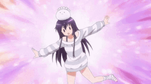a girl with purple hair is jumping in the air while wearing a striped sweater .