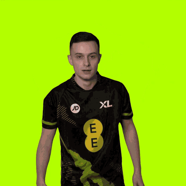 a man is wearing a black xl shirt with a yellow e on the front