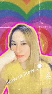 a woman in a yellow shirt with the words " ikaw at ikaw " written on her face