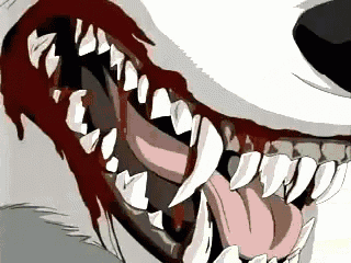 a close up of a wolf 's teeth with blood coming out of them