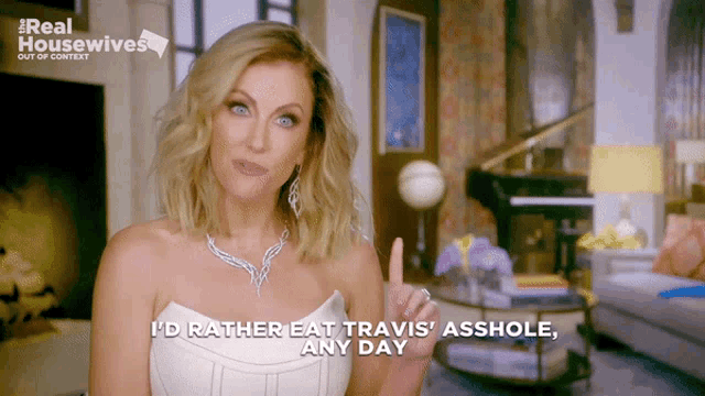 a woman in a white dress says " i 'd rather eat travis ' asshole any day "