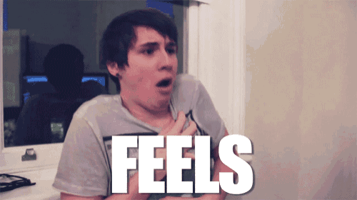 a man with a surprised look on his face is standing in front of a sign that says " feels "