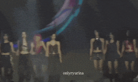 a group of women are dancing on a stage with the words onlyryurina on the bottom right