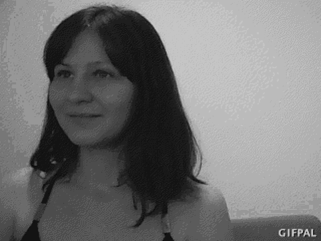 a black and white photo of a woman 's face .