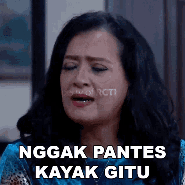 a woman with her eyes closed has the words nggak pantes kayak jitu written on her face