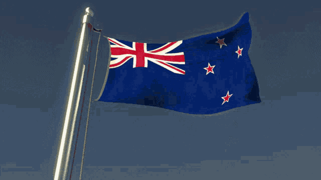 a blue flag with red white and blue stars is waving in the wind