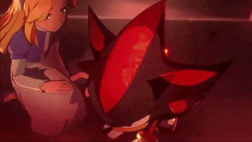 a girl is sitting next to a shadow the hedgehog in a dark room