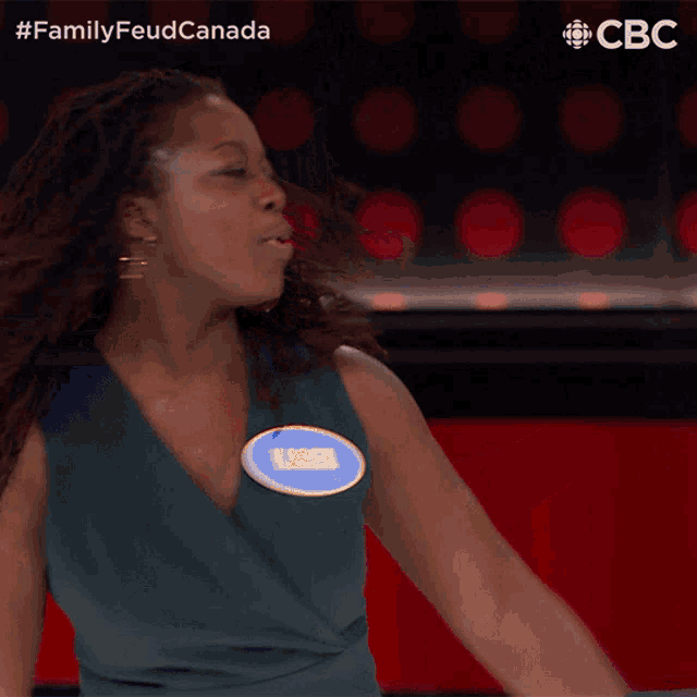 a woman with a name tag that says maggie is dancing