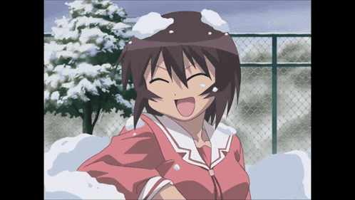 a girl in a pink shirt is standing in the snow and smiling