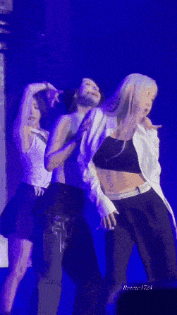 a group of women are dancing on a stage with the name breeze1724 on the bottom right