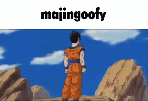 majingoofy is written above a picture of a man standing on top of a mountain