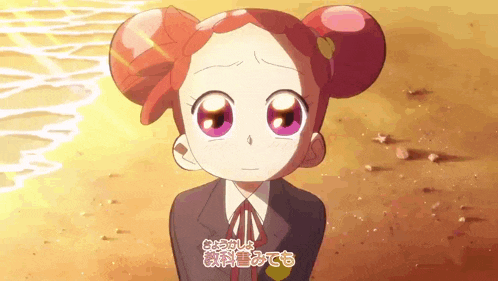 a girl with red hair and purple eyes is standing on a beach