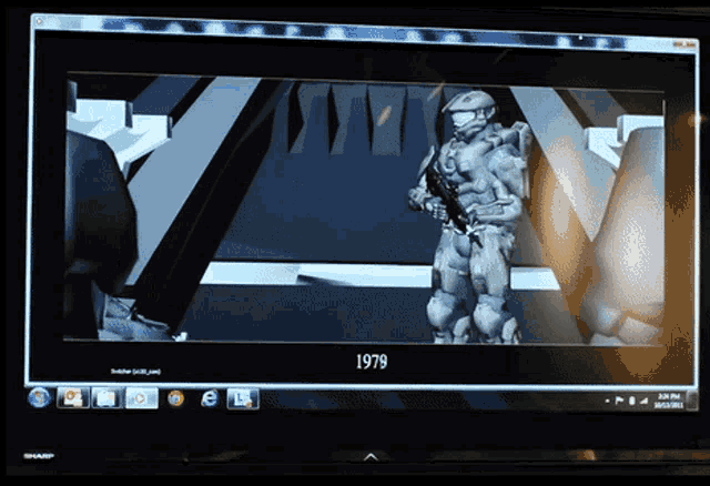 a computer monitor displays a video of a soldier from 1979