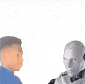 a man is talking into a microphone while a robot is talking into a microphone .