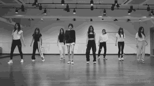 a group of women are dancing in a dance studio