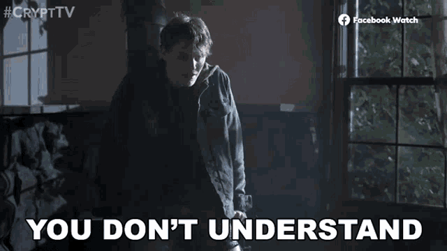 a man is standing in front of a window with the words `` you don 't understand '' written on the screen .