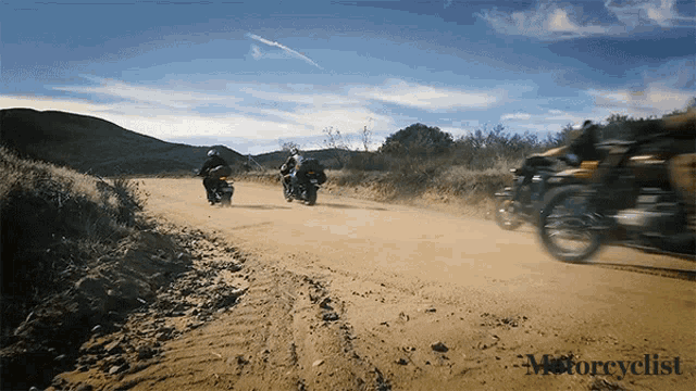 a group of motorcycle riders on a dirt road with the words motorcyclist on the bottom