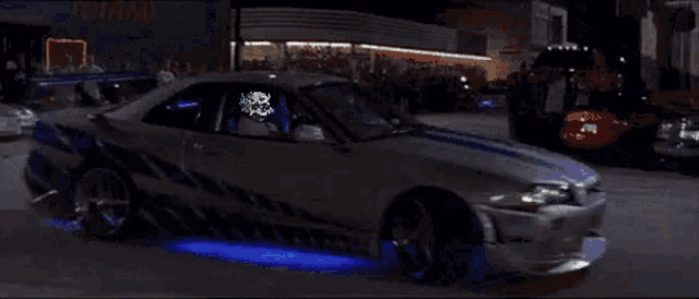 a man in a car with a skull on his face