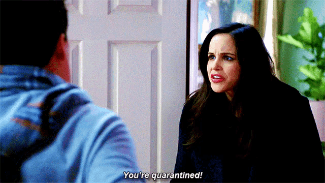 a woman is talking to a man and says you 're quarantined .