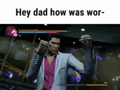 a man in a suit and pink shirt is standing in a video game .
