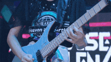 a person wearing a shirt that says heaven on it