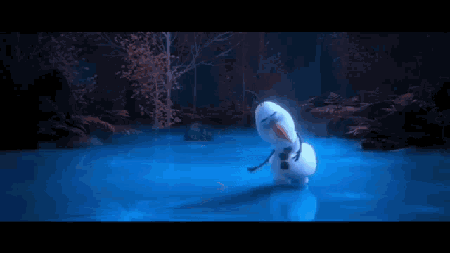 a snowman is standing in the middle of a lake