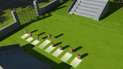 an aerial view of a soccer field with a stadium and a gate