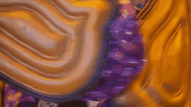 a close up of a person 's face with a purple and yellow background .