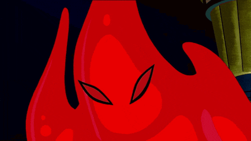a close up of a red cartoon character with a black eye