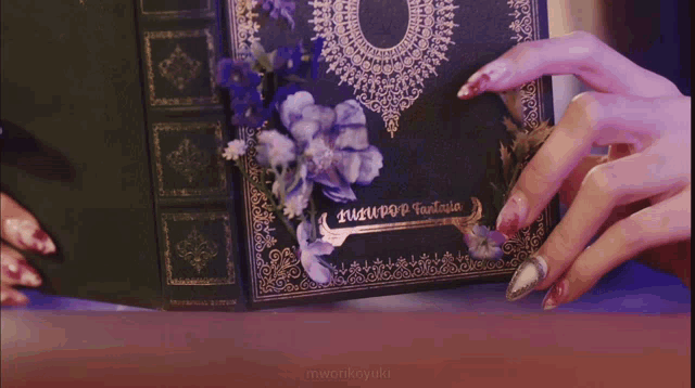 a woman wearing a headband is reading a book .