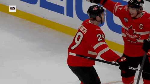 a hockey player wearing a red jersey with the number 9