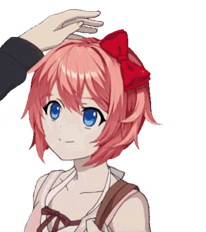 a person is touching a girl 's head with a red bow .