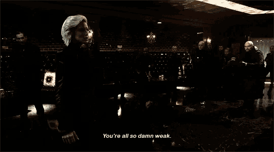 a woman with green hair says you 're all so damn weak in a dark room