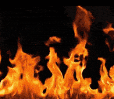 a close up of a fire against a black background