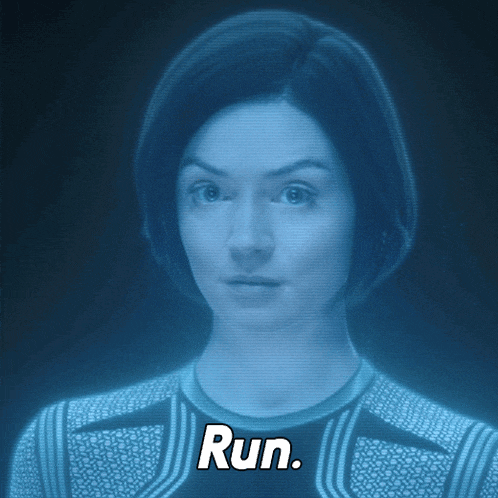 a woman 's face is projected on a screen and the word run is above her head