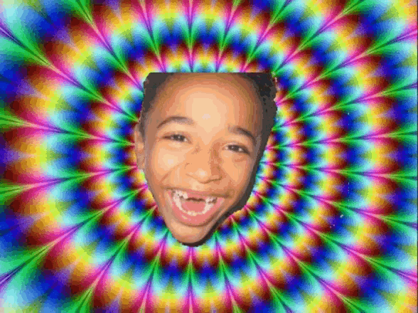 a child 's face is surrounded by a colorful swirl