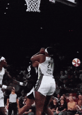 a basketball player with the number 0 on his jersey is standing on the court