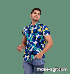a man wearing a colorful shirt and jeans is dancing
