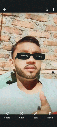 a man with a beard wearing sunglasses that say ' ayang ' on them