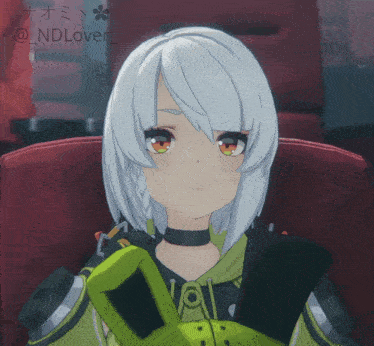 a girl with white hair is sitting in a red chair with the name ndlover on the bottom right