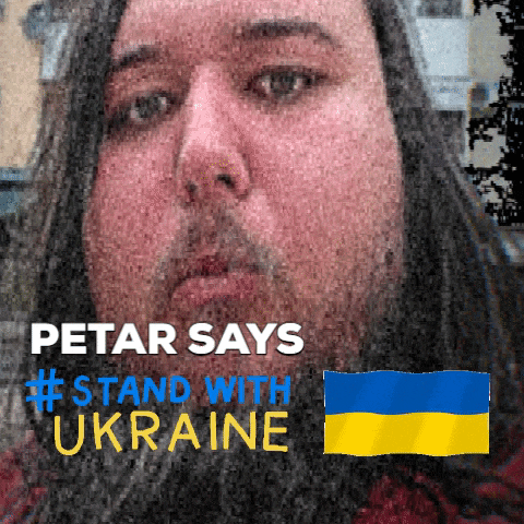 a man with long hair and a beard says #stand with ukraine