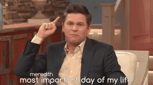 a man in a suit is pointing up with the words meredith most important day of my life above him