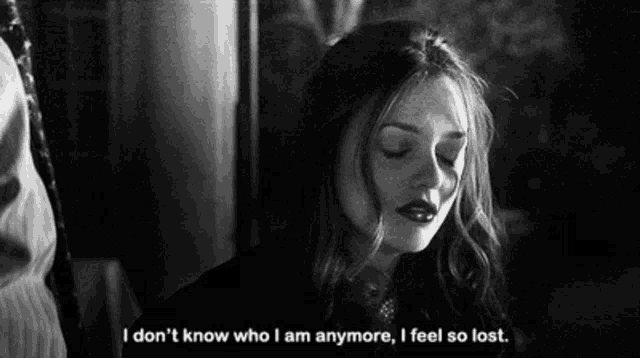 a black and white photo of a woman with the words i don 't know who i am anymore i feel so lost .