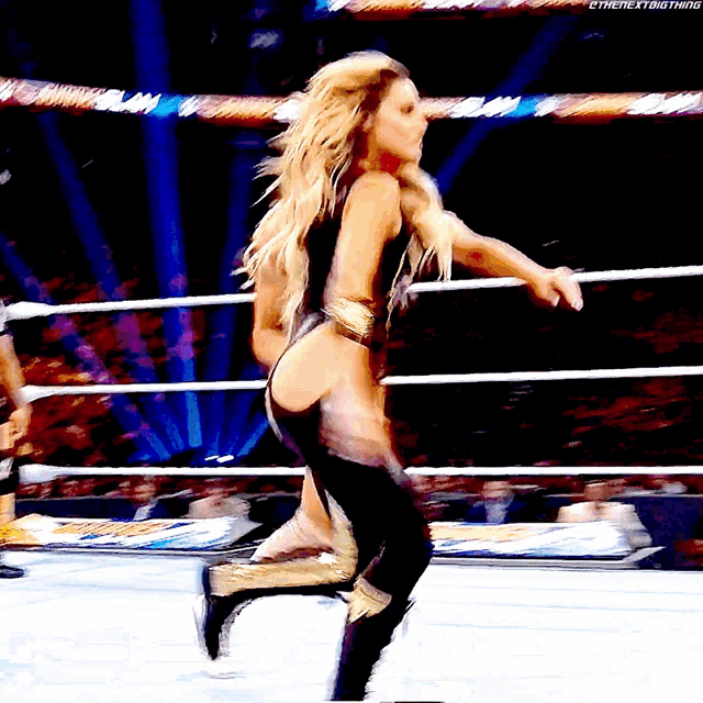 a woman in a wrestling ring has the hashtag #thenextbigthing written below her