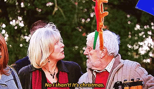 a man with a reindeer antlers on his head says no i shan 't ! it 's christmas